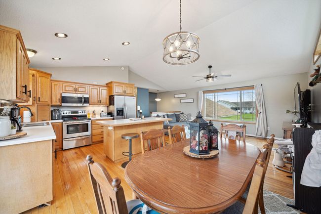 Another view of the dining room and kitchen. | Image 10