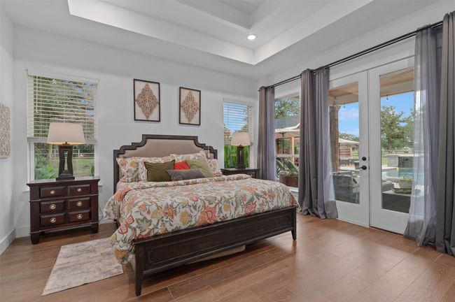 Primary bedroom with patio and pool access | Image 17