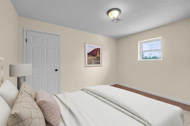 Bedroom with hardwood / wood-style flooring | Image 37