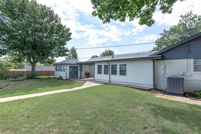 View of front facade with a front yard and cooling unit | Image 37