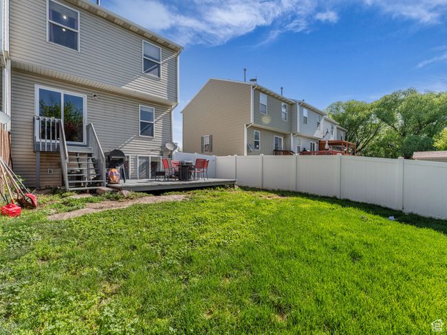 Rear view of house featuring a wooden deck | Image 39
