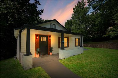 View of front facade with a porch and a lawn | Image 3