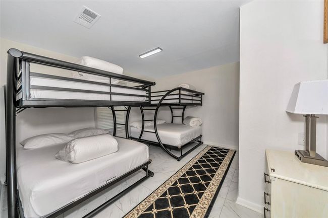 Bedroom featuring light marble finish floors and baseboards | Image 19