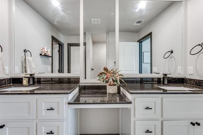Full bath with two vanities, visible vents, and a sink | Image 20