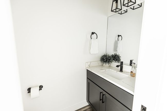 Bathroom with wood finished floors and vanity | Image 17
