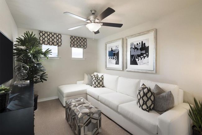 Living area featuring baseboards, ceiling fan, and carpet | Image 38