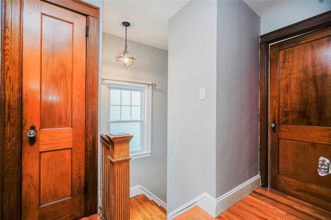 Foyer entrance featuring baseboards and wood finished floors | Image 18