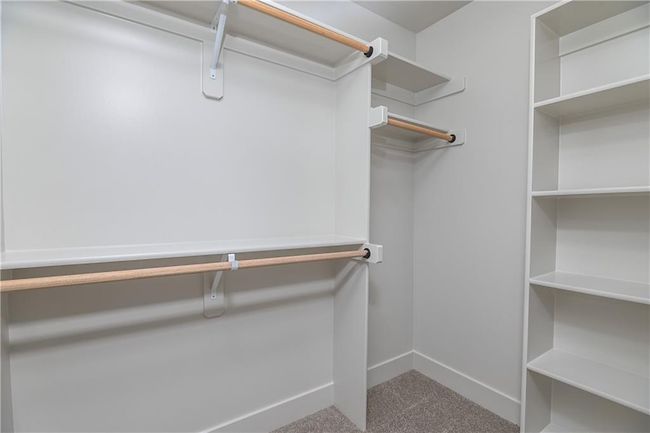 Walk in closet with carpet | Image 38