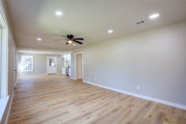 Spare room with a ceiling fan, visible vents, and recessed lighting | Image 7