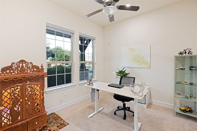 Home office featuring carpet floors and a ceiling fan | Image 7