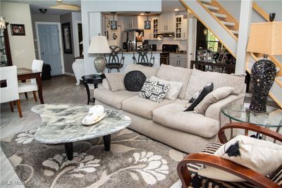 Living room with light hardwood / wood-style flooring | Image 3