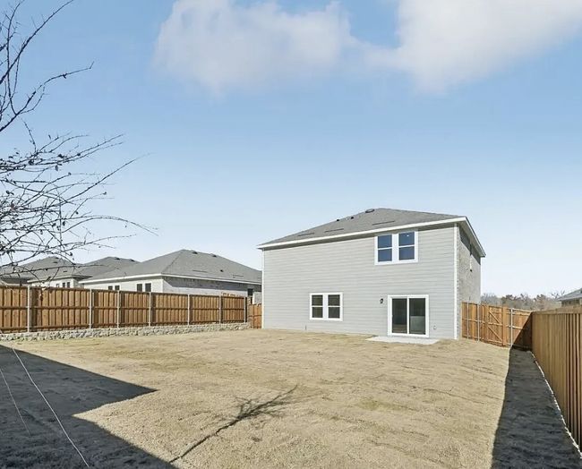 Rear view of house featuring a fenced backyard | Image 6