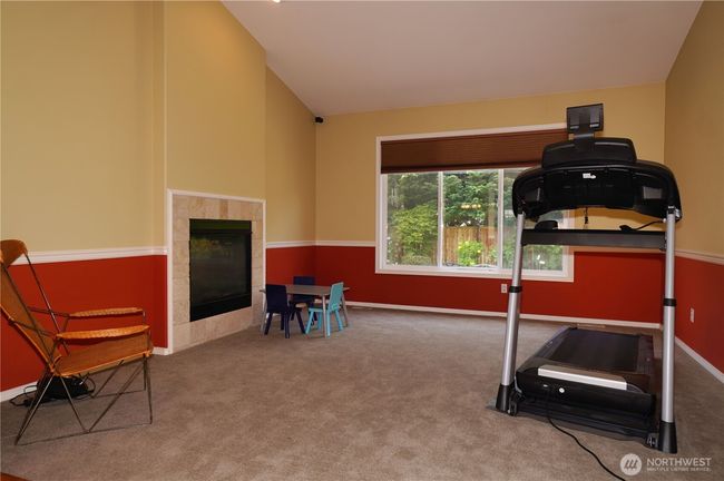 Flex room with gas fireplace, could be formal living room | Image 13
