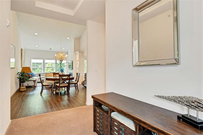 Dining room with, dark wood-style flooring, and recessed lighting | Image 6