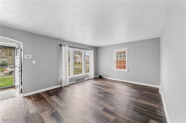 Living room featuring large picture window | Image 5