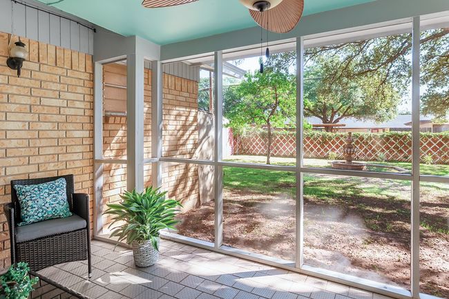 Unfurnished sunroom featuring a ceiling fan | Image 36