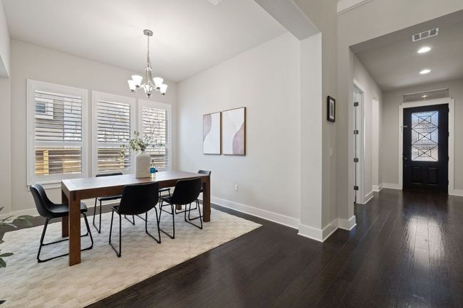The dining room is off of the entry hall. | Image 16