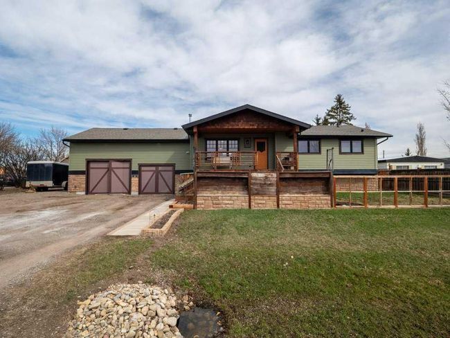 120 Railway Avenue Ne, Home with 4 bedrooms, 2 bathrooms and 4 parking in Langdon AB | Image 1