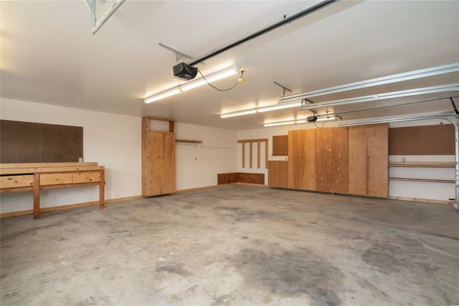 Garage featuring a garage door opener | Image 35