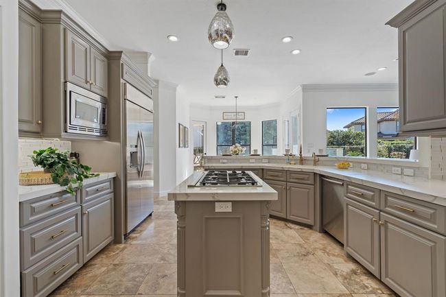 Easy access to the breakfast room creates a seamless flow between spaces for convenient living and dining. | Image 12