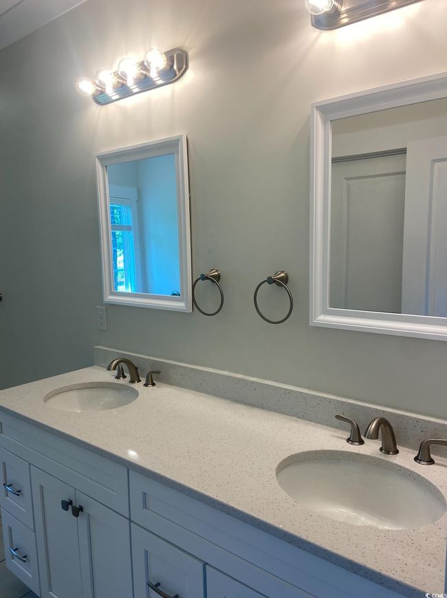 Full bathroom featuring double vanity | Image 24