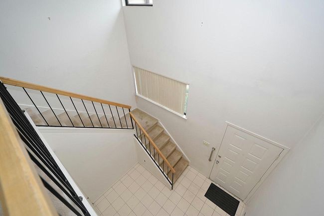 Staircase featuring tile patterned flooring | Image 17