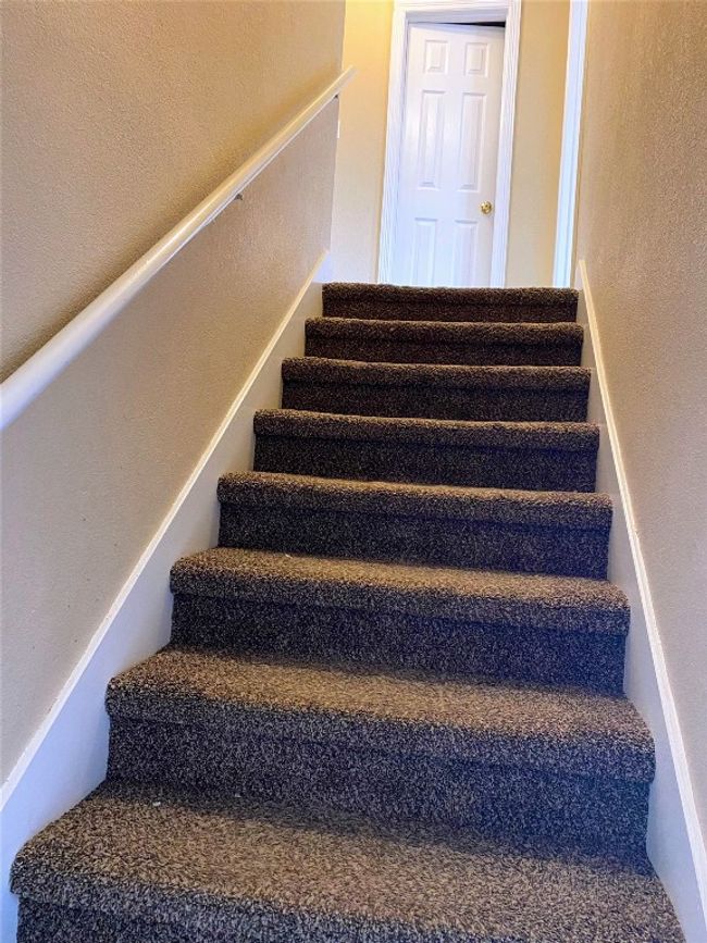 Stairs with a textured wall | Image 13