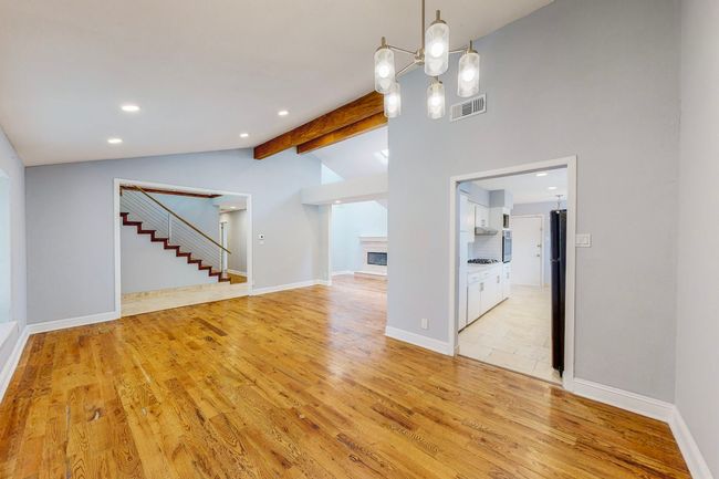 Living area, adjoining dining area leading to kitchen | Image 22