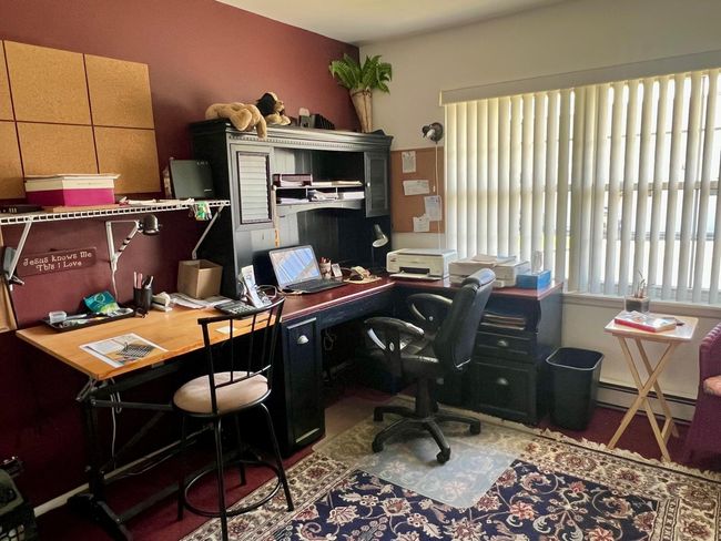 Home office featuring a baseboard radiator | Image 13