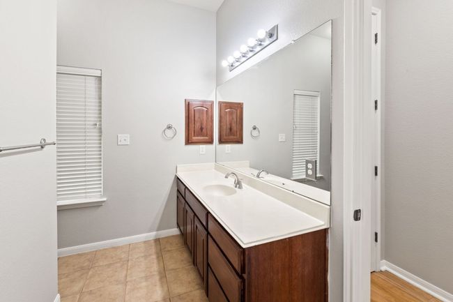 Bathroom with vanity and baseboards | Image 21