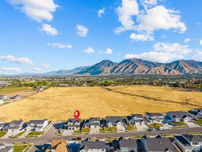 Aerial perspective of suburban area featuring a mountain backdrop | Image 64