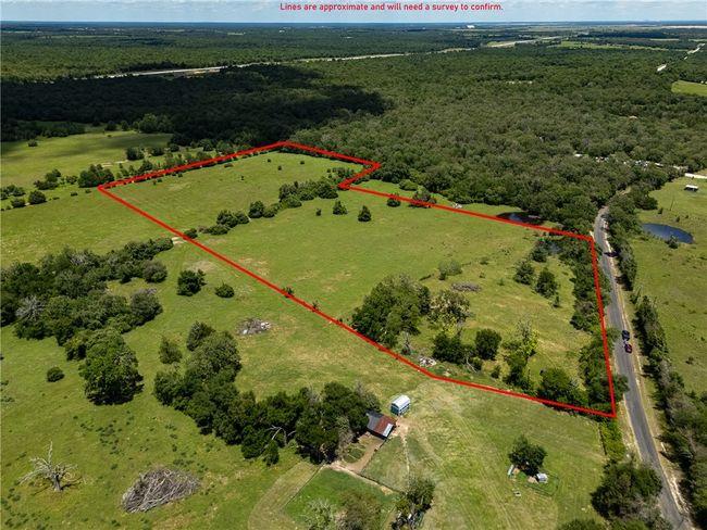 Overview of rural landscape featuring property boundaries highlighted and a forest | Image 33