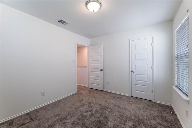 Unfurnished bedroom with carpet and baseboards | Image 8