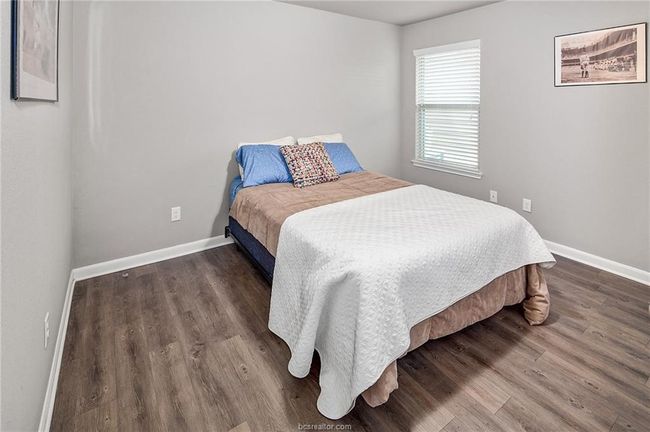Bedroom with dark hardwood / wood-style floors | Image 15