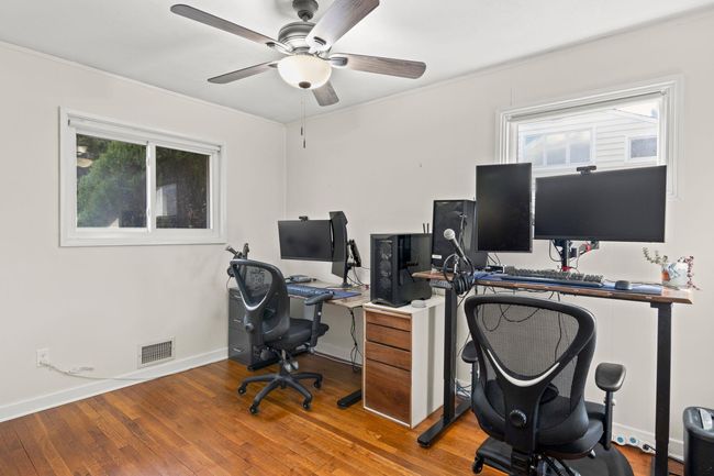Bedroom or Office plenty of natural light, a ceiling fan, and hardwood floors | Image 18