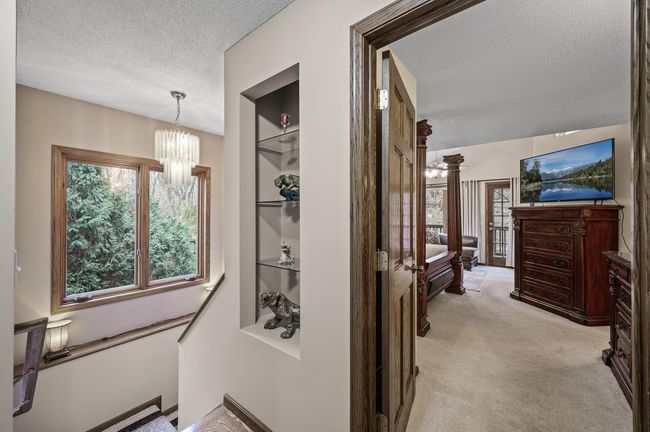 Main floor hallway and stair access to the lower level and the two lower level bedrooms | Image 29