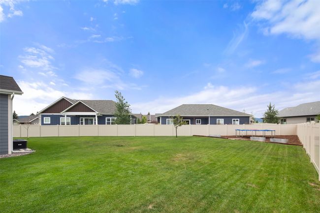 Entire back & side yard vinyl privacy fenced. | Image 9