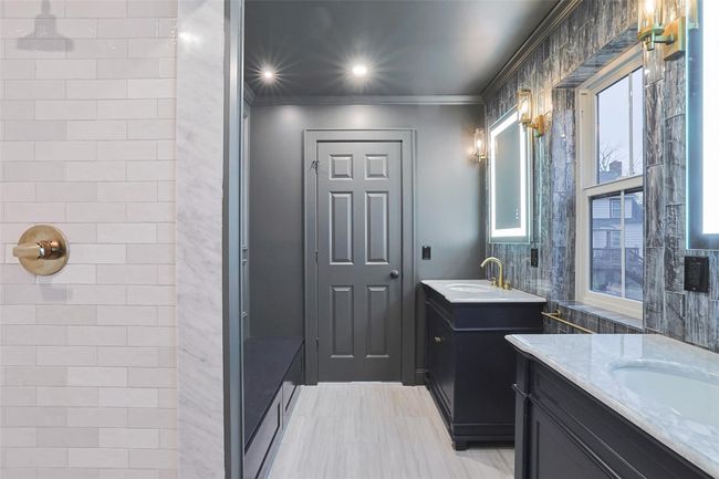 Fashion forward dark and moody design elevates this space. | Image 28