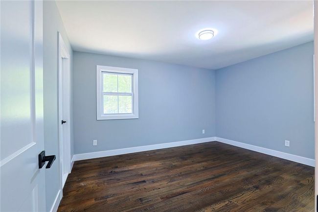 Empty room featuring dark hardwood / wood-style flooring | Image 11