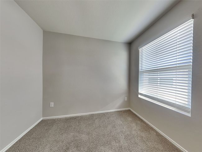Carpeted spare room with baseboards | Image 12