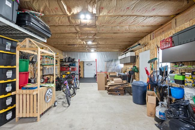 Extended garage with 1 car parking, shop/storage area | Image 33