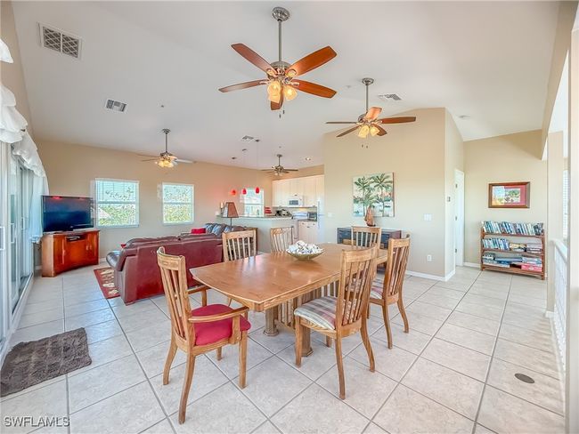 Dining room featuring visible vents, baseboards, and light tile patterned flooring | Image 9