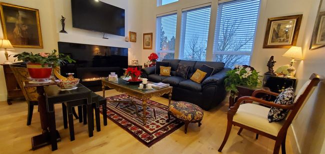 Living area with wood finished floors | Image 9