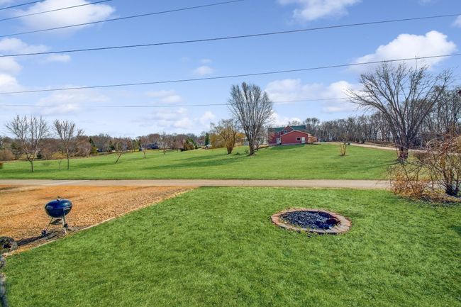 Plenty of space outside on your large .3 acre of a lot as well as a 3 stall garage! | Image 21