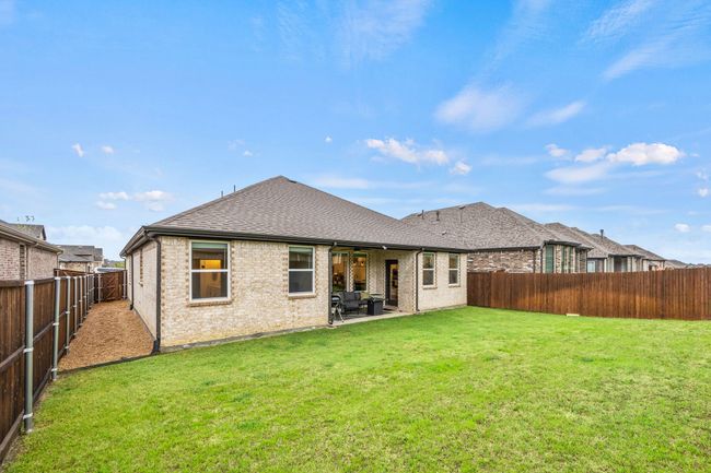 Back of house with a patio, brick siding, and a shingled roof | Image 23