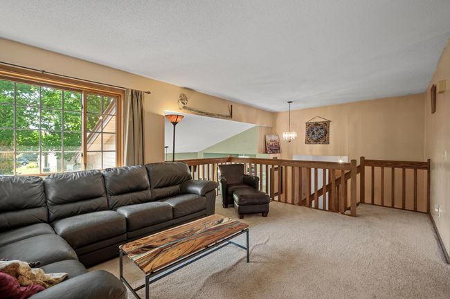 Spacious, light and bright living room with large windows allowing an abundance of sunlight to stream through. | Image 8