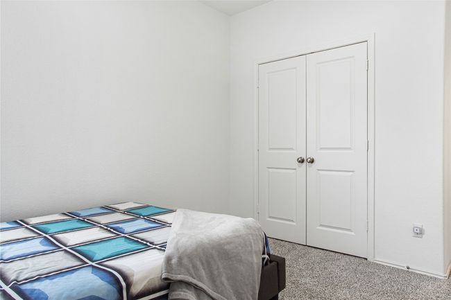 Bedroom with light carpet and a closet | Image 20