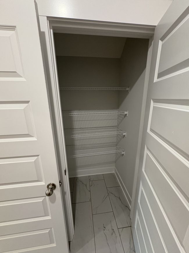 STOCK PHOTO. SELECTIONS WILL VARY IN ACTUAL HOUSE. Secondary pantry in laundry room. | Image 12