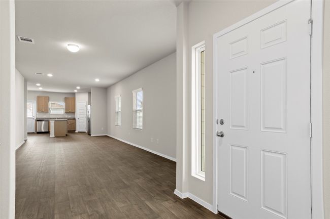 Foyer featuring baseboards, dark wood finished floors, recessed lighting, and visible vents | Image 5