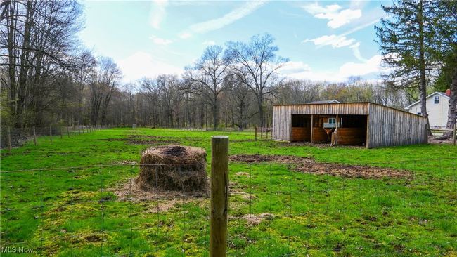 View of yard with an outbuilding, an outdoor structure, and fence | Image 35